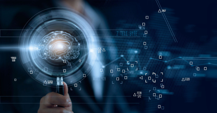Businessman,Holding,Magnifying,Glass,And,Digital,Brain,,Searching,Of,A